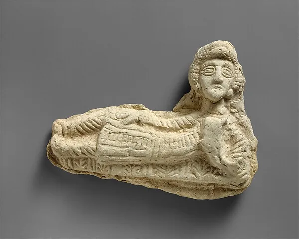 Plaque in the form of a reclining man — تصویر رکورد موزهٔ متروپولیتن (دسترسی آزاد)