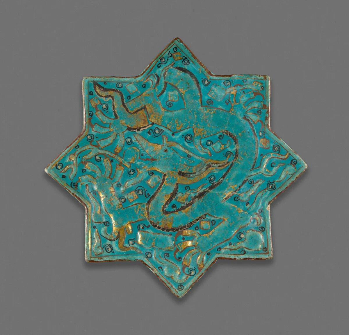 Turquoise Glazed Star-Shaped Tile with a Dragon — تصویر رکورد مؤسسهٔ هنر شیکاگو (دسترسی آزاد)