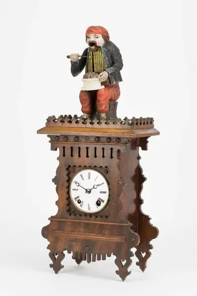 Tischuhr mit "Knöpflefresser", Anton Häckler, Vöhrenbach, um 1870 — تصویر رکورد یوروپیانا