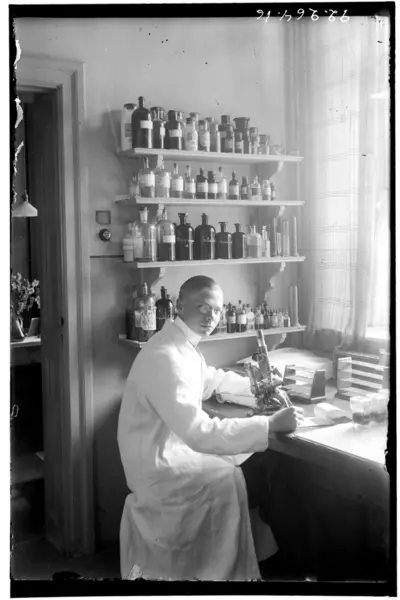 Hålhult’s sanatorium, interior, labratorie? a man sitting at a microscope — تصویر رکورد یوروپیانا
