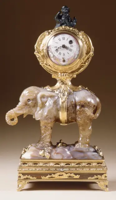 Miniature clock in the form of an elephant supporting a watch case — تصویر رکورد ویکی‌داده